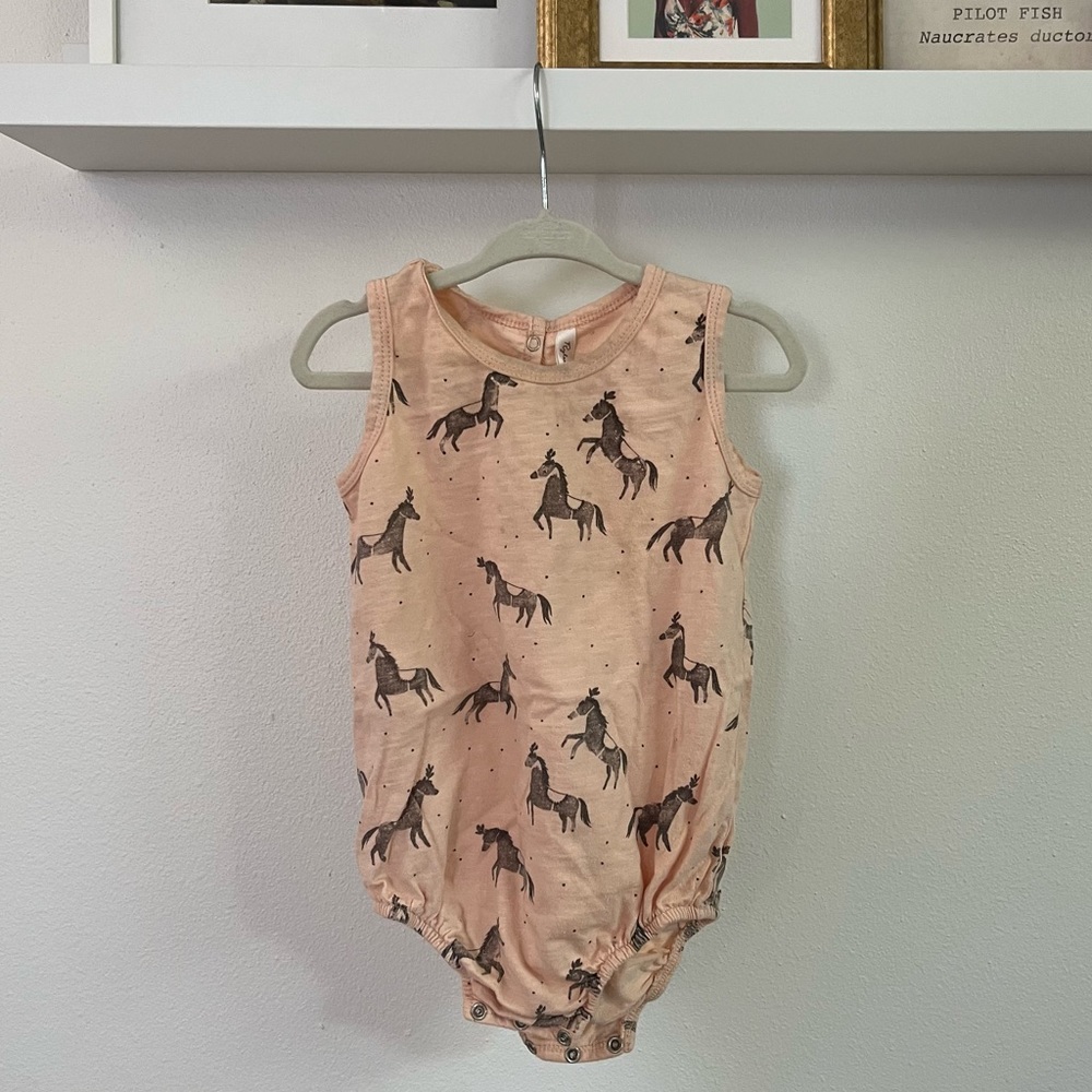 Rylee + Cru peach onesie with circus horses